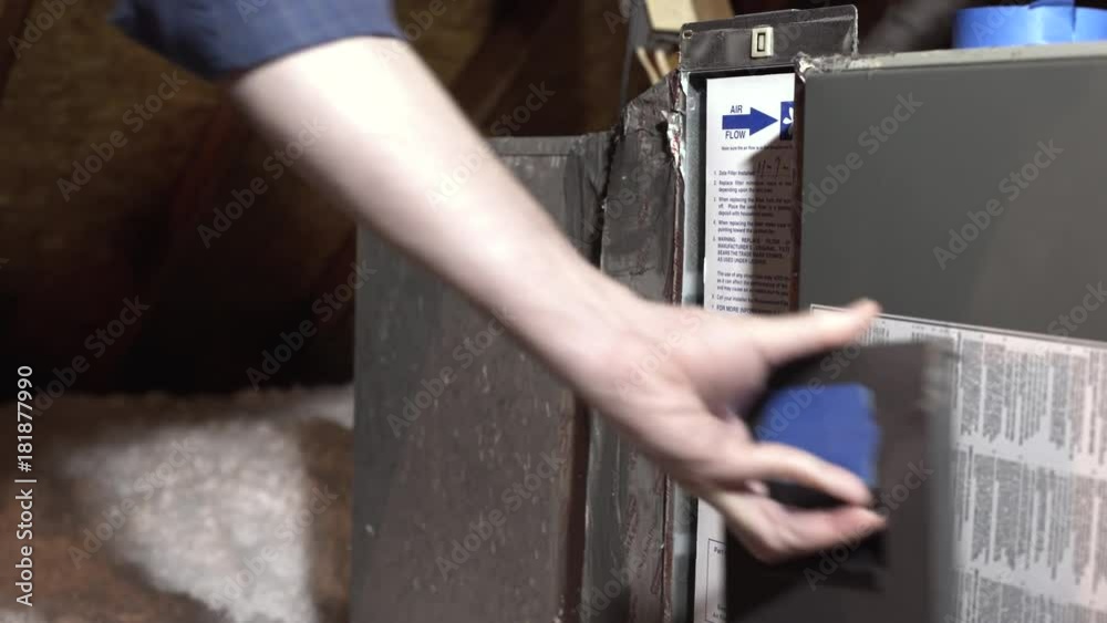 homeowner replacing the whole house air conditioning filter in attic 4k