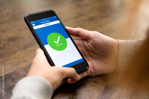 Konstfotografi Woman successfully transferred money online via electronic internet banking appl