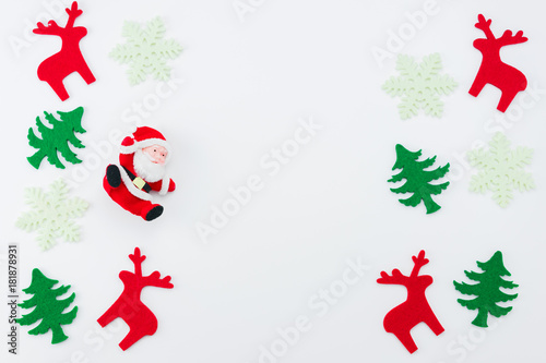 Christmas composition. Christmas tree, dear, Santa Claus on white background. Flat lay, top view © ronnachaipark