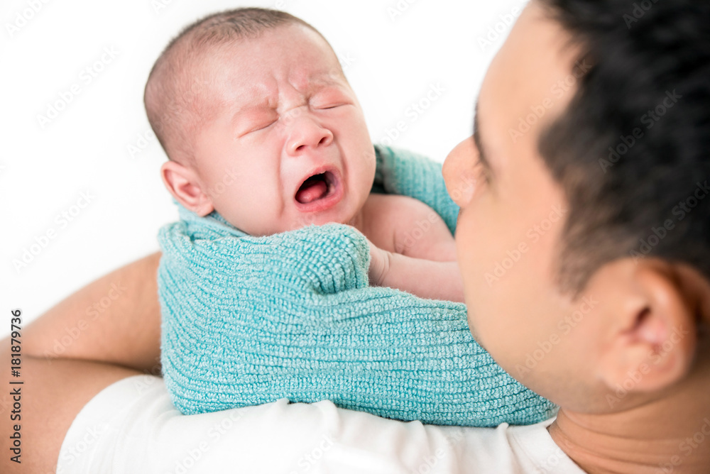 Young dad with cute little newborn baby child in his arms Young dad with cute little newborn baby child in his arms