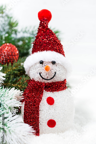 christmas snowman in fir branches on a white background, closeup © cook_inspire