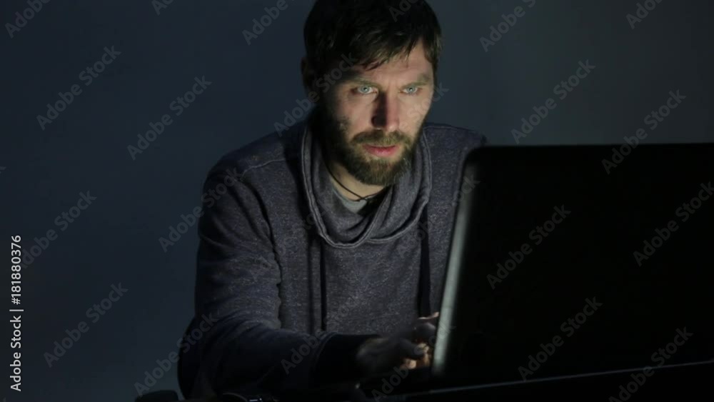 frustrated bearded man working on laptop very surprised and upset frustrated bearded man working on laptop very surprised and upset