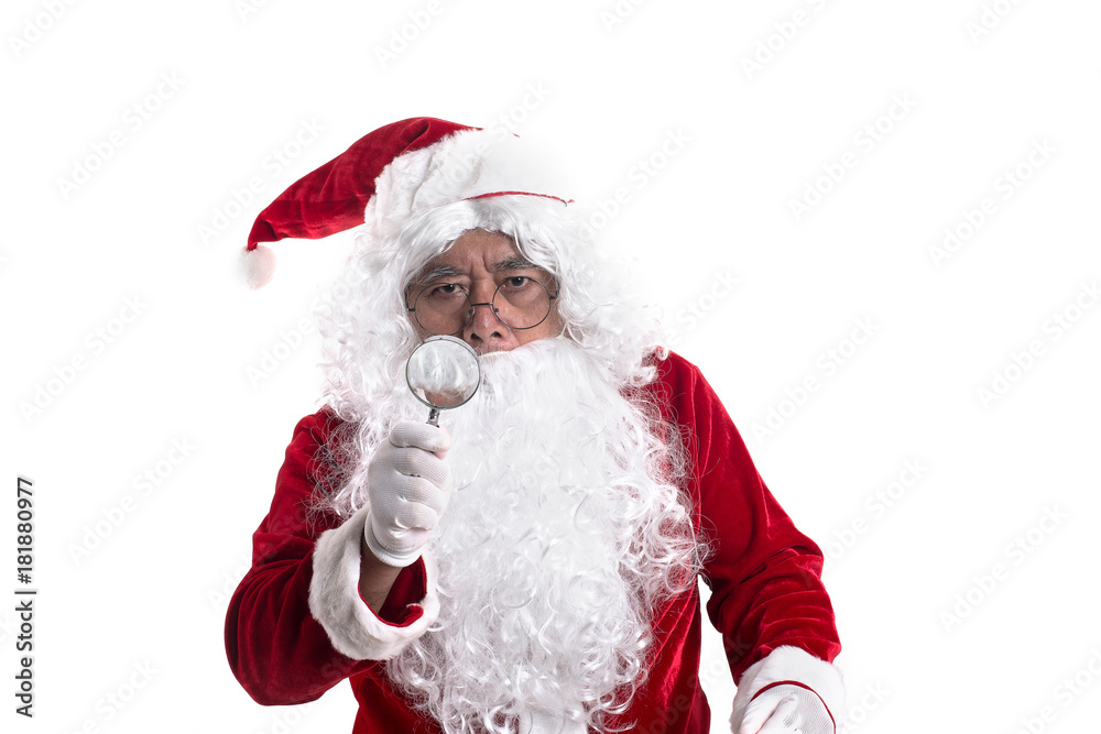 Portrait of santa looked with curiosity through a magnifying glass on camera isolated on white background. Portrait of santa looked with curiosity through a magnifying glass on camera isolated on white background.