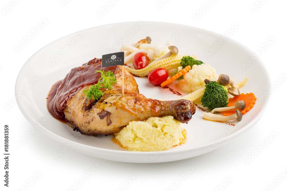 Grilled chicken legs and vegetables in white dish isolated on white background Grilled chicken legs and vegetables in white dish isolated on white background