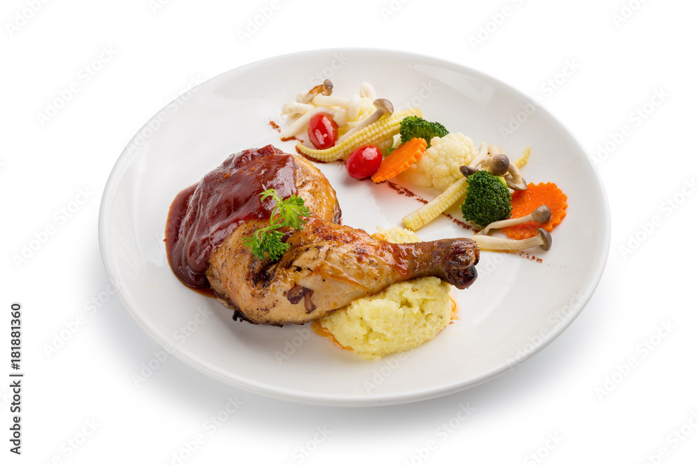 Grilled chicken legs and vegetables in white dish isolated on white background Grilled chicken legs and vegetables in white dish isolated on white background