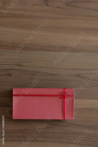 Christmas Gift box on wooden background. Christmas Time celebration.