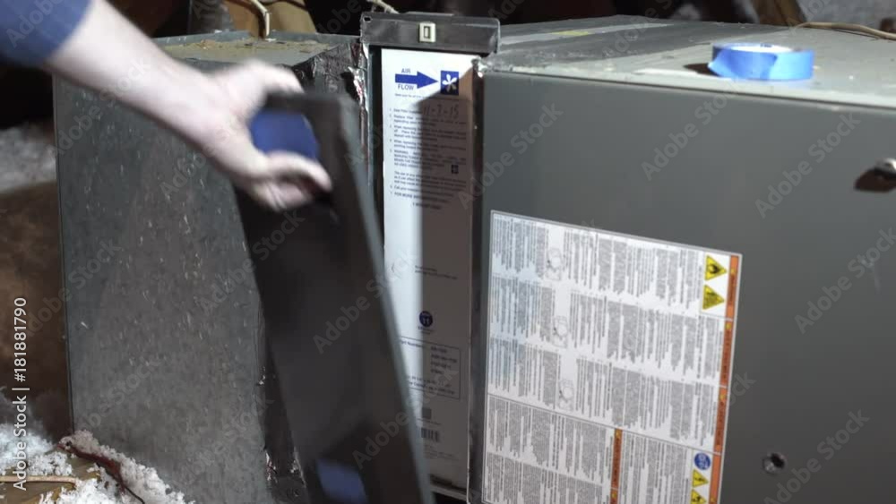 homeowner replacing the whole house air conditioning filter in attic 4k