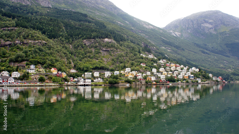 Fototapeta premium View of colorful wooden houses on a hill in Odda on the Sorfjord, Norway