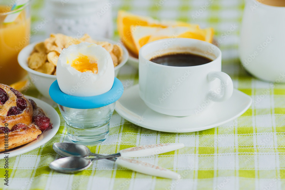 Soft boiled chicken egg, coffee, baking, muesli and orange juice Soft boiled chicken egg, coffee, baking, muesli and orange juice