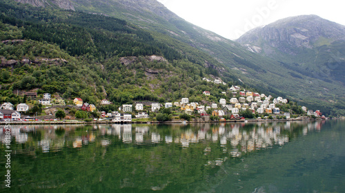 View of colorful wooden houses on a hill in Odda on the Sorfjord, Norway