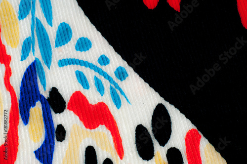 Synthetic knitted fabric, white and black background. The flowers are red and blue. A red and blue pattern on a black background, incredible weight and quality, photo