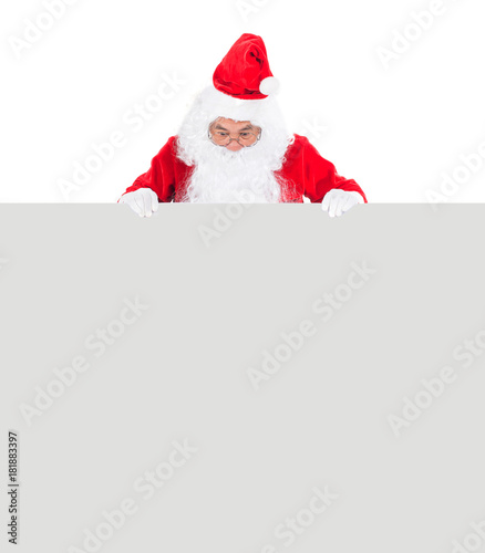 Close up of Santa with a banner isolated on white background © Johnstocker