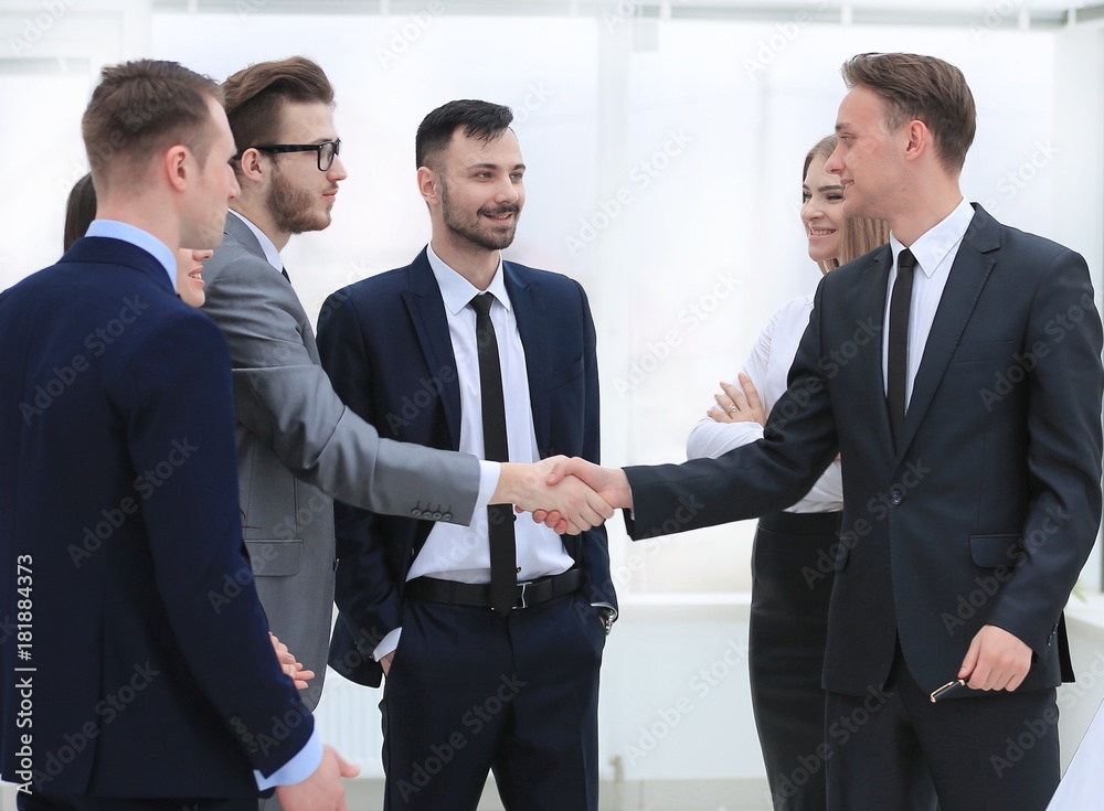 handshake Manager and the client in the office handshake Manager and the client in the office
