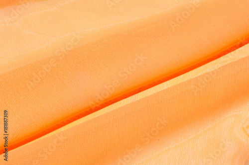 Background texture pattern. Silk crepe of chiffon peach peachpuff Introducing the sultry and stunning  Silk Satin you see here. Duchess satin is a gorgeous high-fiber count medium-bodied low luster photo