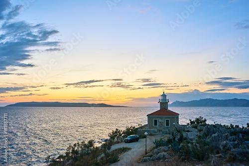 Amazing sea bay with old lighthouse on sunset in Makarska, Croatia