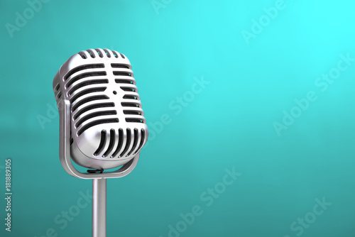 Retro microphone with turquoise wall background