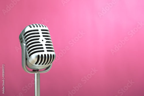 Retro microphone with pink wall background