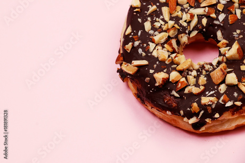 Delicious donut with chocolate almond glazed, Isolated on pink background.