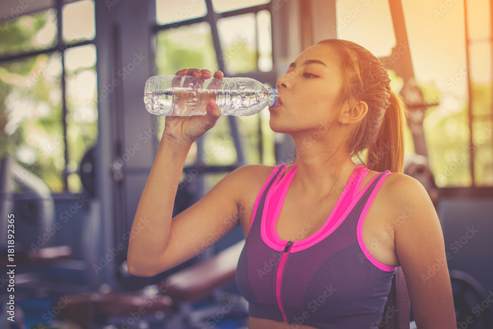 fitness people doing exercises and building muscle at gym ; healthy lifestyle fitness people doing exercises and building muscle at gym ; healthy lifestyle