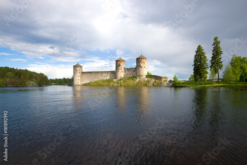 Medieval Olanvinlinna fortress and the Curensalmi strait under a thunder-storming sky. Savonlinna  Finland