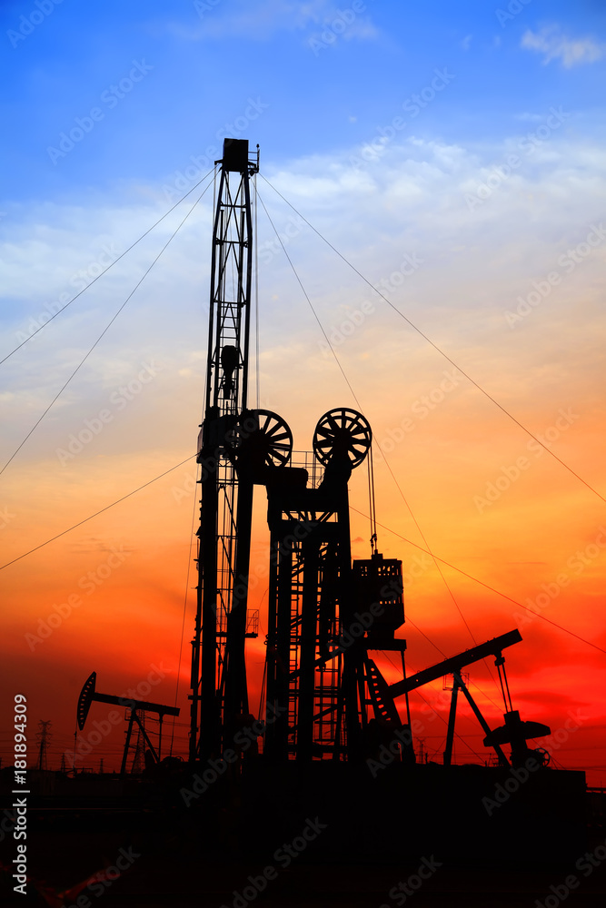 the silhouette of oilfield derrick the silhouette of oilfield derrick