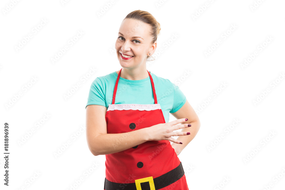 Housewife wearing red Christmas apron showing number four Housewife wearing red Christmas apron showing number four