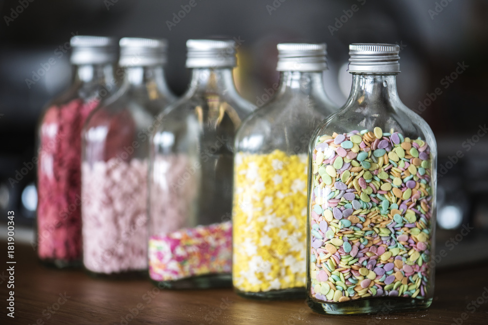 Bottles with colorful sprinkles Bottles with colorful sprinkles