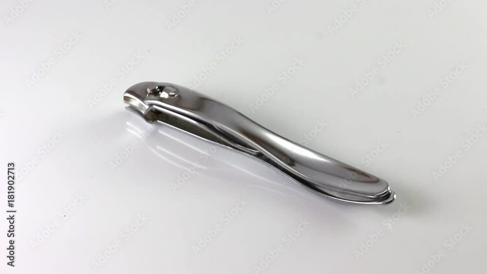 Nail clipper oscilates on a white background Nail clipper oscilates on a white background
