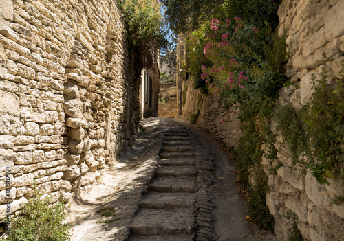 Steep alley with medieval houses in Gordes. Provence, France © wjarek