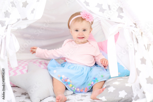 Cute baby in festive clothe...