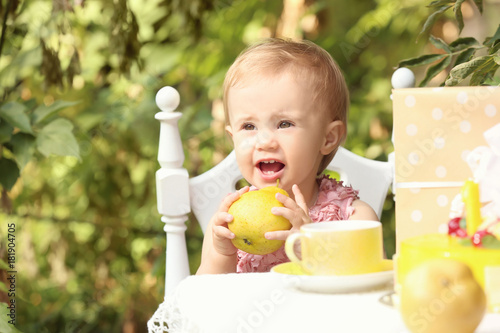 Cute baby at festive table ...