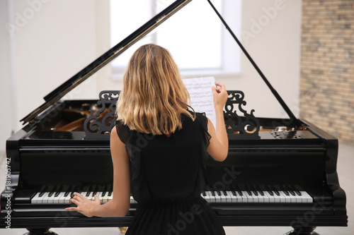 Talented woman playing pian...