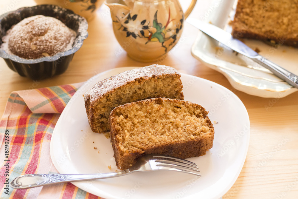 sweet almond homemade cake on white plate with coffee