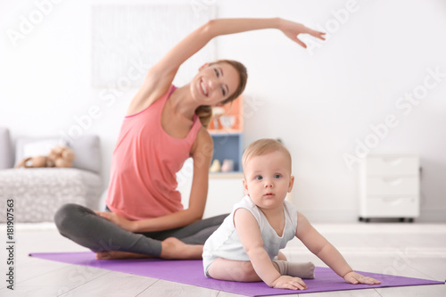 Cute baby and young mother ...