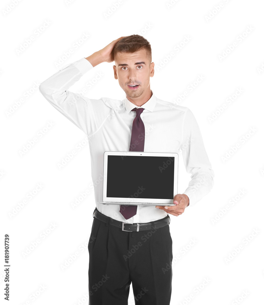 Thoughtful young businessman with laptop on white background