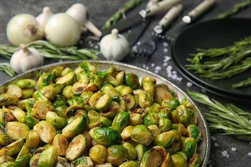Metal tray with roasted brussel sprouts on table