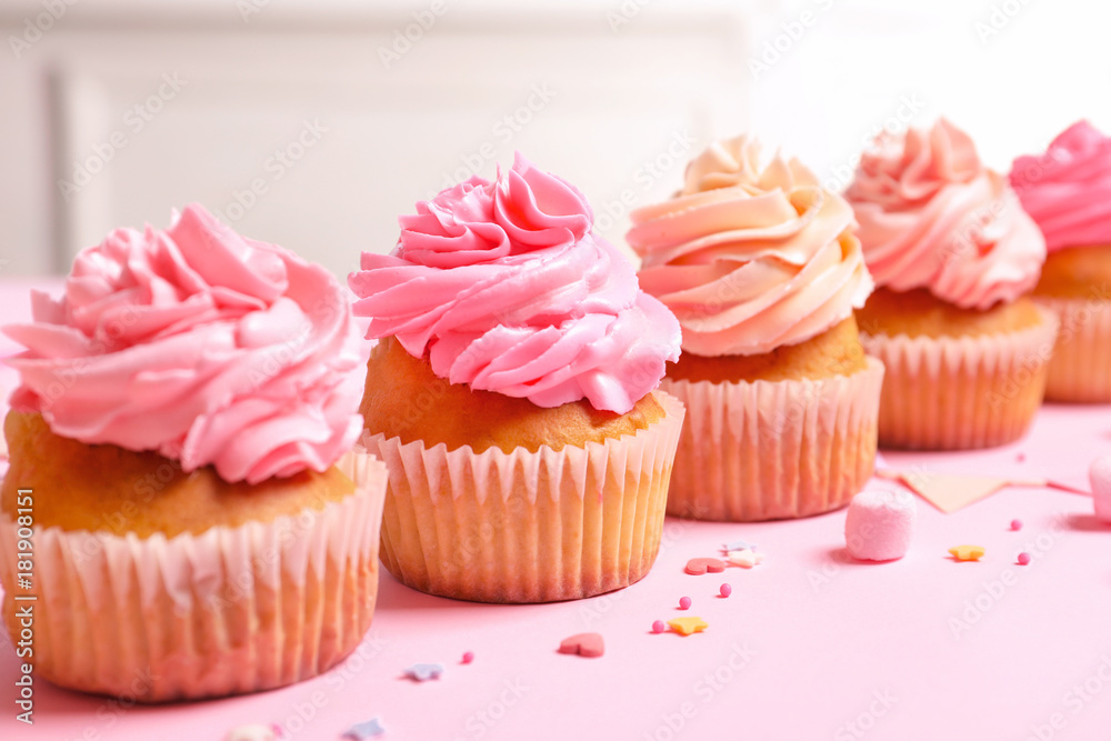 Many yummy cupcakes on table Many yummy cupcakes on table