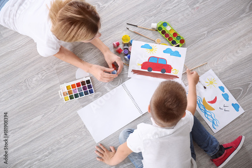 Mother with cute boy painti...