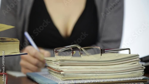 close-up glasses on a exercise books, teacher works without glasses after vision correction