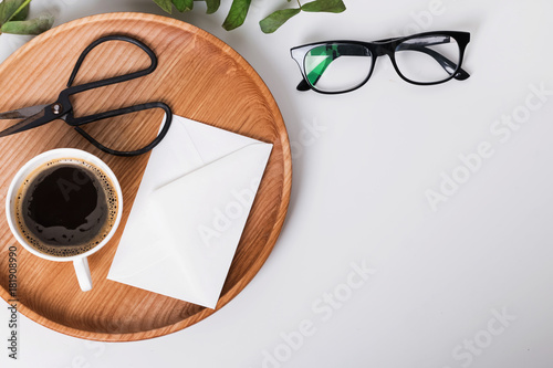 Coffee, scissors and glasses on the white background