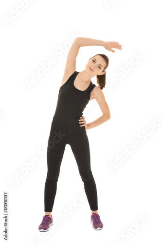 Young sporty woman doing ex...