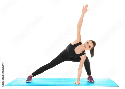 Young sporty woman doing ex...