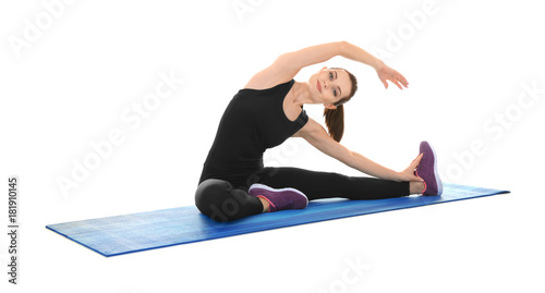 Young sporty woman doing ex...