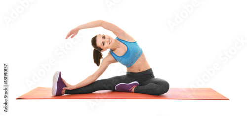 Young sporty woman doing ex...