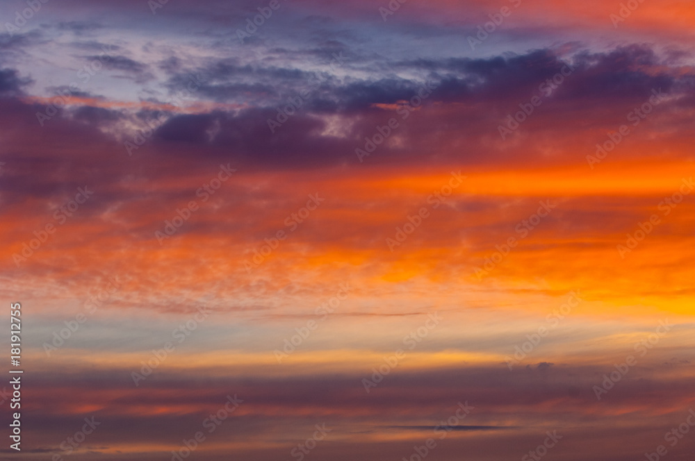 Texture, background, pattern. Evening, morning sky, bright colors on the clouds.Colorful sky and sunrise. Natural landscape. Early morning sky with colors from deep blue to orange.