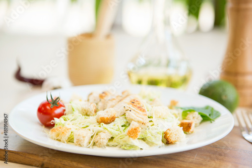 Homemade Vegetable salad with chicken and cheese on table