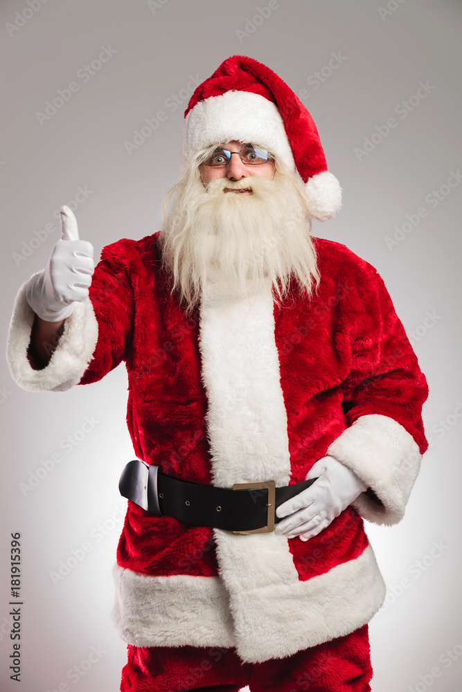 portrait of a positive santa claus making the thumbs up portrait of a positive santa claus making the thumbs up