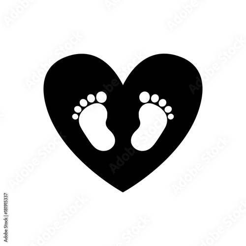 Baby footprints inside of black heart icon isolated on white background.
