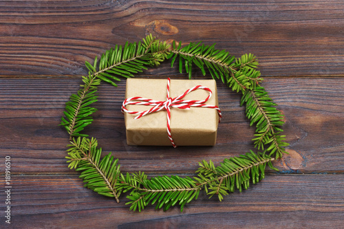 Black wooden christmas background. twigs of thuja. Original, fresh floral design for xmas card. empty space for holiday greetings photo