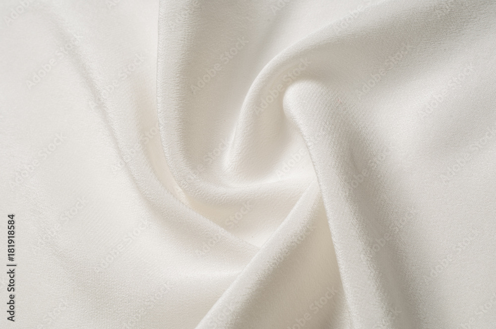 Texture background pattern. White silk fabric. Closeup of a rippled white silk fabric. Advertising space. Smooth elegant white silk can be used as a wedding background.